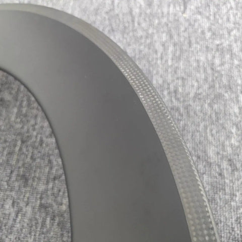 Close-up of the 700C Carbon Wheelset For Road Bikes, Ultra Light T800 Carbon Fiber, 80mm deep rim showing rim texture