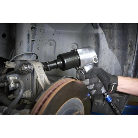 Mechanic using 231C Half Inch Drive Air Impact Wrench With Beefy 600 Ft Lbs Torque, 8000 RPM, Twin Hammer on car brake system
