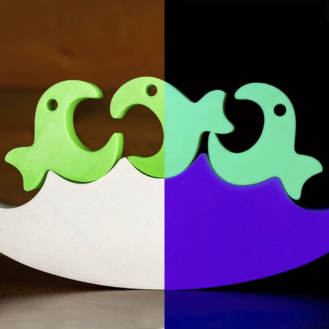 Fluorescent Green PLA Filament 1.75Mm For 3D Printing shown in custom fish toy design with vibrant colors and smooth finish.