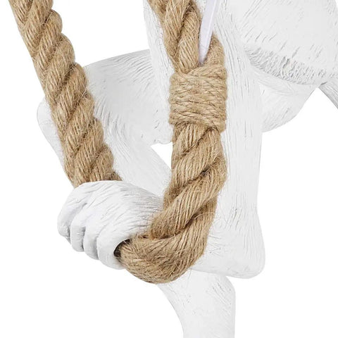Close-up of Monkey Pendant Light Fixture With Hemp Rope showing detailed resin monkey hand holding rope.