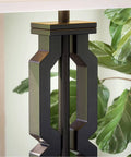 Close-up of a Tall Black Floor Lamp With White Rectangular Shade, 59.5 Inch Height, plastic construction, next to plants.