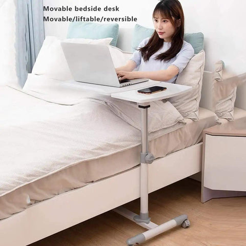 Smooth Rolling Tilt Top Height Adjustable Standing Desk With Heavy Duty Carbon Steel Frame And Locking Wheels For Seamless Over Bed Workstations And Lowkey Productive Home Office Vibes with a user working on a laptop.