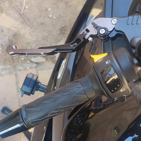 Close-up of Top Tier Folding Brake And Clutch Levers For Benelli BN302S showing ergonomic black aluminum lever design.