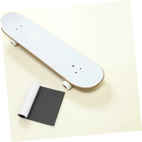 Non Slip Deck Covering For Skateboard And Kick Scooter Waterproof PVC Grip Tape beside skateboard deck on light background