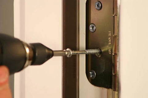 8440P Pro Grabit Broken Bolt And Damaged Screw Extractor 4 Piece Kit in use, extracting screw from door hinge