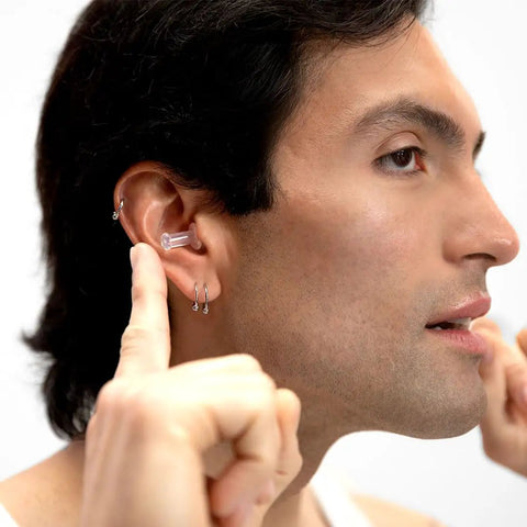 Man using Flight Ready Earplugs For Ear Pressure Relief On Flights Pain Free Takeoffs And Landings Cut Cabin Noise And The Hum Of Engines
