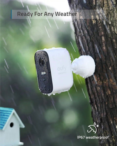 Two Camera Wireless Outdoor Security Kit, 1080p HD, IP67 Weatherproof, Night Vision, Motion Alerts, HomeKit Compatible, No Monthly Fee, Simple Setup, Real Talk Home Security That Keeps You In The Loop installed on tree in rain