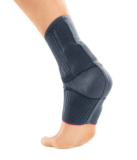 Side view of Knit Achilles Ankle Support Brace For Men And Women With Silicone Inlays And Dual Heel Wedges, Moderate Compression Foot Wrap For Post Surgical Recovery And All Day Stabilization, Silver.