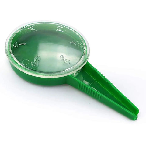 Close-up of green seed dispenser from 4 Pack Garden Hand Planter Seeder Tool Set with Adjustable Seed Dispenser for sowing seeds.