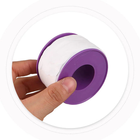 PTFE Thread Seal Tape For Metal Pipes And Threads, Heavy Duty Sealant That Stays Tight At High Temps And Corrosion, Leakproof For Emergency Repairs And Everyday Plumbing Jobs. White PTFE tape roll on purple spool held in hand