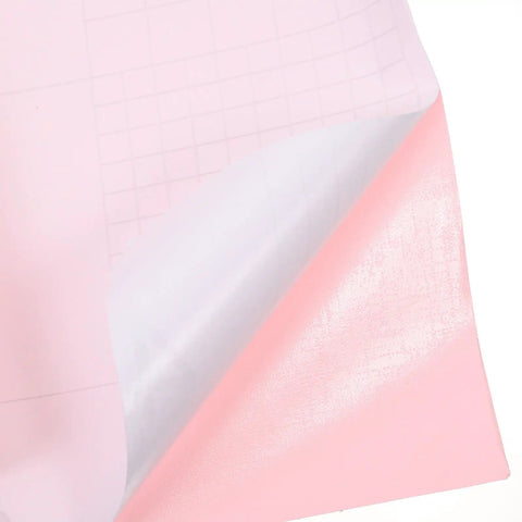 Close-up of Premium Pink Peel And Stick Wallpaper Self Adhesive PVC Waterproof Furniture Cover's pink film backing.