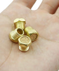 Four Piece Sintered Bronze Breather Vent Kit One Eighth Inch NPT For Single Acting Cylinders Or Valves in hand view.
