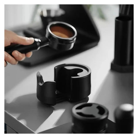 Heavy Duty Adjustable 51 53 58 Millimeter Portafilter Holder Tamping Platform crafted from tough aluminum with portafilter.