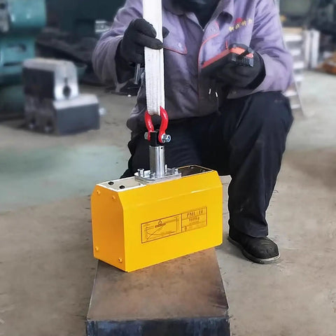 Heavy Duty Automatic Magnetic Lifter 2200 Lbs Capacity Plunger Operated Design in use lifting metal block.