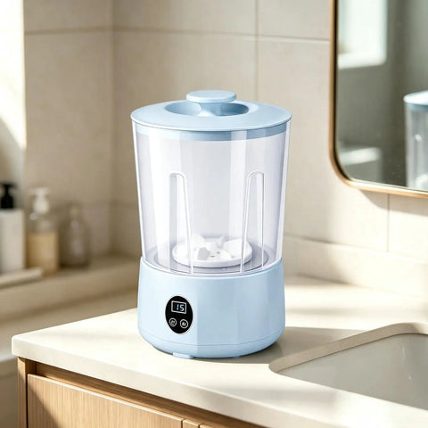 Solid Mini Portable Washing Machine With Three Speed Gears For Effortless Underwear And Sock Cleaning An Easy Peasy Game Changer For Dorms Apartments And Travel on a bathroom counter.