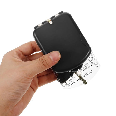 Multi Function Orienteering Compass With Luminous Dial Ruler Scale And Mirror held showing sleek ABS design