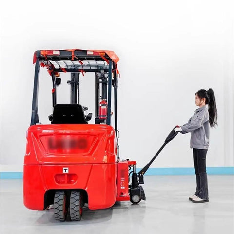 Heavy Duty Full Electric Pallet Jack With 4400 Lb Capacity And 48V Lithium Battery Built For Tight Indoor Spaces featuring a user operating it.