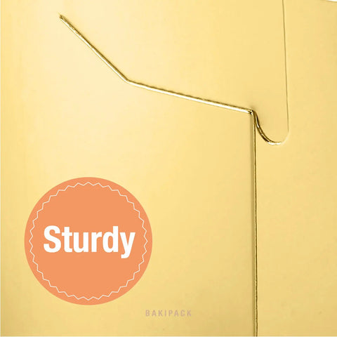 Close-up of a sturdy fold in a Premium Gold Bakery Box, showcasing its 5x5x3.5 inch size and solid food-grade material.