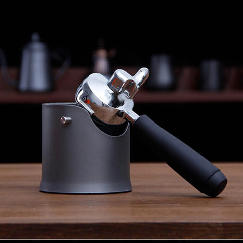 Zero Stress Espresso Knock Box With Shock Absorbent Deep Bowl For Quick Coffee Grounds Cleanup And Solid Tamping Station Setup Perfect For Serious Home Brewers And Everyday Cafe Crews close-up view of espresso knock box with portafilter.