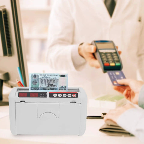 Portable Rechargeable Cash Counting Machine With UV And MG Counterfeit Detection in use at checkout counter