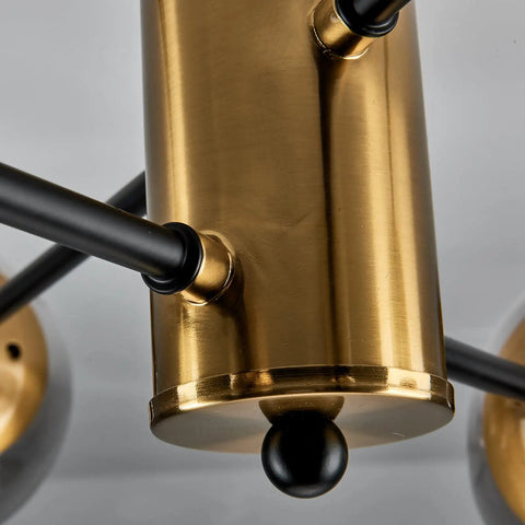 Close-up of 6-Light Sputnik Gold Ceiling Light Fixture With Glass Globe, semi-flush mount, black arms, mid-century style detail.