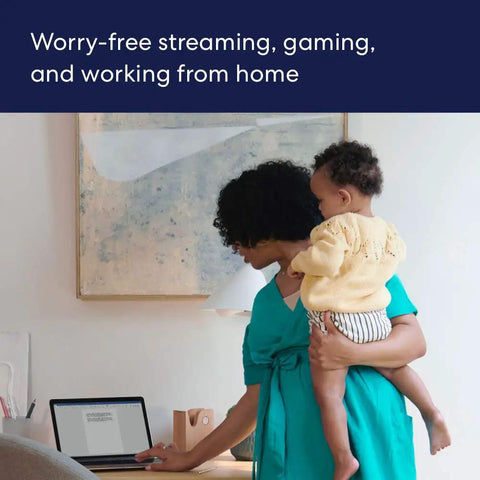 Woman holding baby, working on laptop, demonstrating Like-New Eero 6 Mesh WiFi Extender for Up to 1,500 Sq Ft Boost, Add-On Coverage