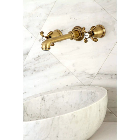 8-Inch Center Wall Mount Bathroom Faucet in Brushed Brass with European-Inspired Detailing, installed above marble basin
