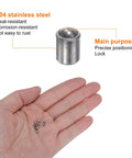 Thirty Piece Top Shelf Ball Point Spring Plungers 304 Stainless Steel 2X3mm Precision Positioning Beads Ball Catch Latch For Cabinet Doors And Slick Furniture Hardware held in hand with 304 stainless steel plunger.