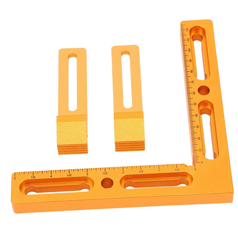 Precision Built T Slot Perforated Table System With Heavy Duty Aluminum Vise Clamps And Dope CNC Workpiece Positioning Fixture For Quick Milling Setup And No Sweat Engraving, orange L-shaped square and two clamps.