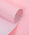 Solid Pink Peel And Stick Wallpaper Waterproof PVC Wall Cover With Nifty Self Adhesive Backing For Quick Cabinet Makeover, rolled up detail.