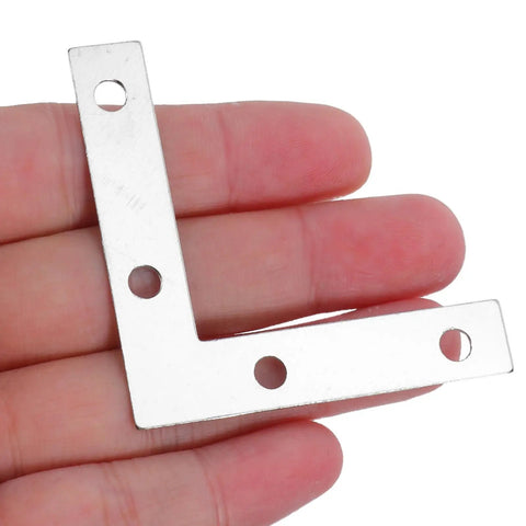 Close-up of Heavy Duty L Shape Right Angle Corner Brackets 100 Pack With Flat Profile Iron Metal Fixing Braces in hand