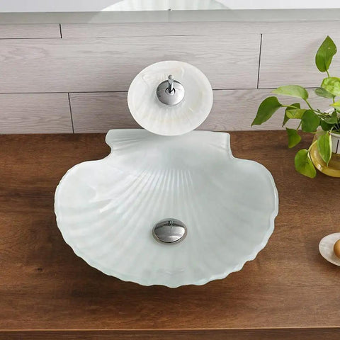 Upgrade Your Bath Game With This Killer Shell Tempered Glass Vessel Sink and Waterfall Faucet Featuring Hot Cold Rotary Mixer Tap Heavy Duty Countertop Wash Basin Smooth Durable Build - Top view of shell-shaped glass sink with waterfall faucet.