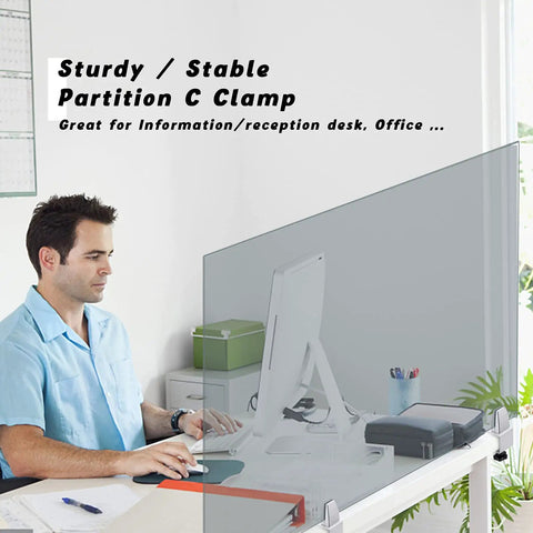 Man at desk with Heavy Duty Aluminum Sneeze Guard Clamp Set For Desks And Countertops, supporting clear acrylic panel.