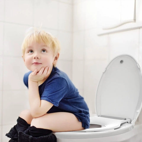 Child sitting on a Smooth Closing Elongated Toilet Seat Featuring Built In Toddler Potty Training Insert and Reliable Slow Drop Lid.