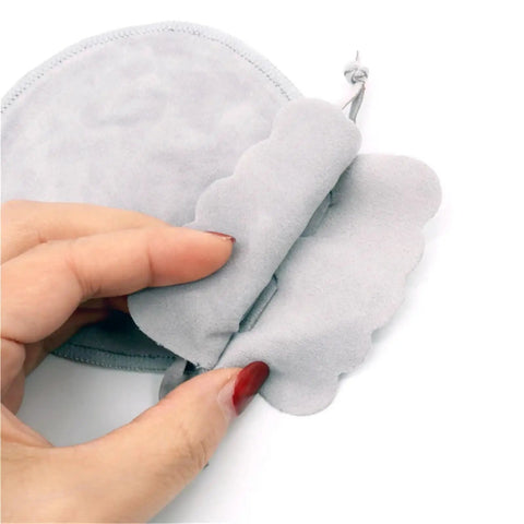 Hand holding a soft interior of the 60 Pcs Small Velvet Jewelry Pouches Drawstring Bags Gift Ready For Rings Earrings Necklaces And Bracelets Soft Velvet Interior No Scratch Edges Ideal For Display Storage Packaging Supply And Gift Giving.