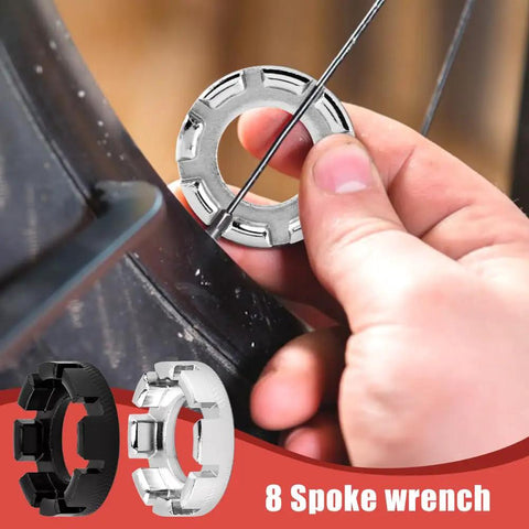 No Sweat Road Warrior Bike Repair Kit featuring five universal spoke wrenches in use on a bicycle wheel for rim adjustments.