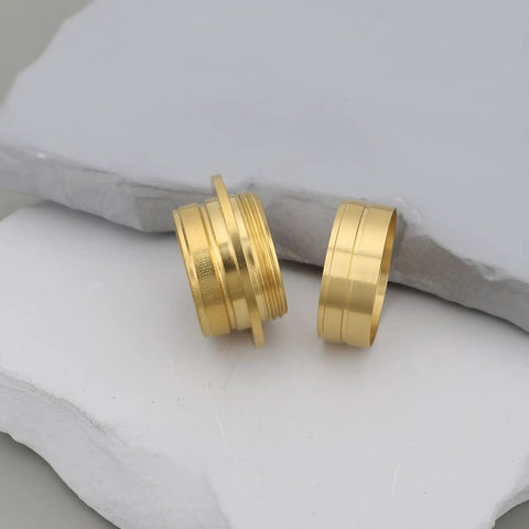 Heavy Duty Solid Brass Threaded Inserts For Precision Woodturning And Secret Compartments, showcasing two inserts on stone.