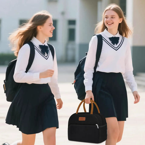 Two students walking with Insulated Lunch Bag For Work Travel And School Leakproof 10L Tote Reusable Stylish Oxford Fabric Lunch Box in black.