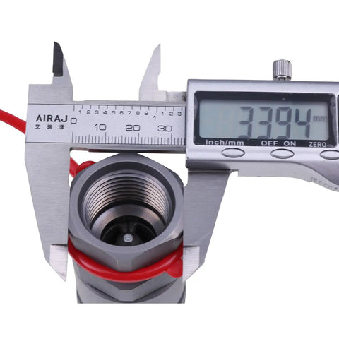 Close-up of 1/2-Inch Hydraulic Female Flat Face Quick Coupler 7246790 Bobcat Compatible being measured with caliper