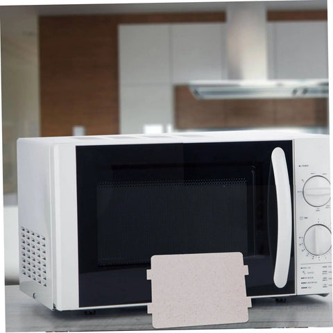 Microwave Oven Mica Sheets 10 Pack Cuttable Waveguide Cover shown in front of a white microwave on a kitchen counter.