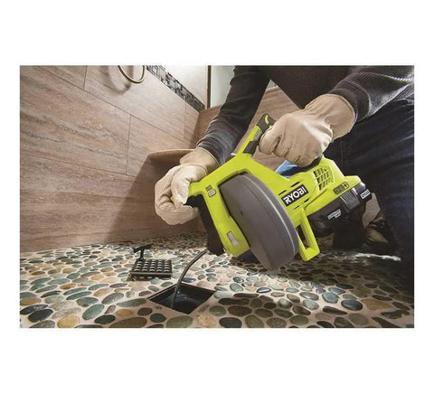 Person using 18V Cordless Drain Auger Tool Only P4001 For Quick Clog Busting Lightweight Electric Sewer Snake on floor drain