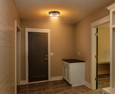 Black Drum Flush Mount Ceiling Light Fixture With Seeded Glass Creates Rustic Farmhouse Vibe For Porch Hallway And Bedroom Perfect For Any Space With Warm Glow And Industrial Charm in hallway setting