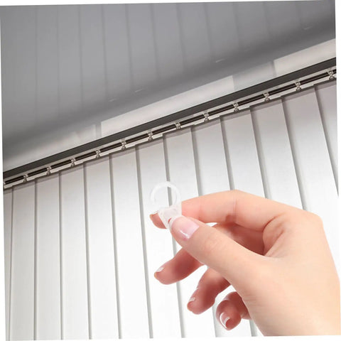 Hand holding clear hook showing 40 Pack Plastic Curtain Hooks For Doors And Curtain Rods With Silent Glide No Fuss Easy Hanging For Home And Bathroom