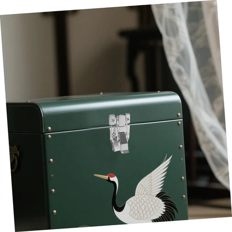 Close-up of Six Pack Vintage Duckbilled Toggle Latch Kit With Screws on a green wooden chest with crane design.