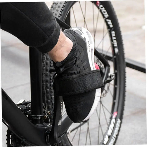 Cyclist wearing Two Pack Black Pedal Straps For Kids Bikes And Fixed Gear Pedals Toe Clip Style Cycling Straps on a bicycle pedal