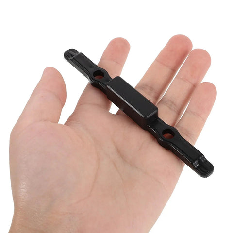 Snag This Heavy Duty Luggage Handle Button Replacement for Telescopic Suitcase Pull Rods held in a hand, black plastic material.