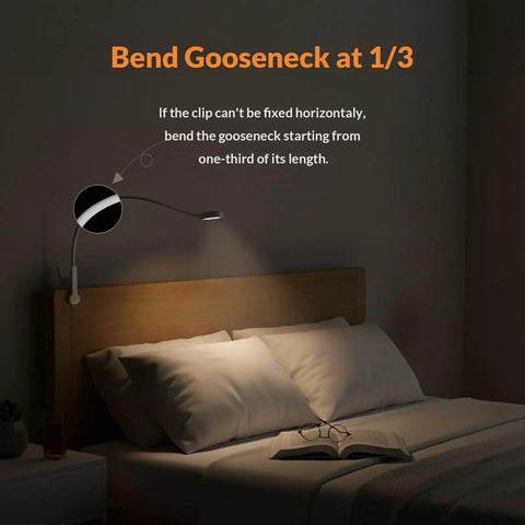 Top Shelf Clip On Reading Light With Bendy Gooseneck For Desks And Bed Rails illuminating a bedside with a book and glasses.