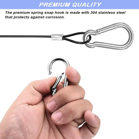 Close-up of hand holding part of 15 Pack 8 Inch Stainless Steel Tethers With Four Spring Snap Hook Clips Vinyl Coated Steel Wire Cable