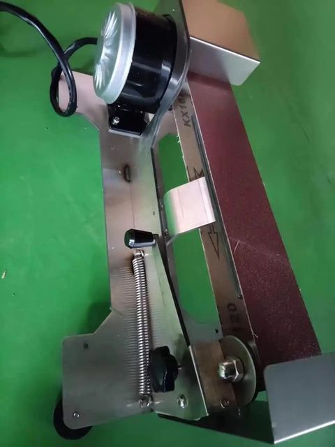 Knockout 600W Electric Knife Sharpener With Water Cooled Belt Sander And Variable Speed Wet Dry Grinder Featuring Polishing Wheel close-up view of belt and motor.