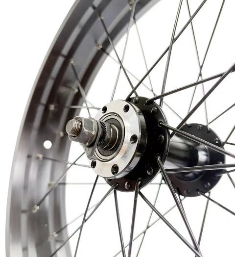 Close-up of Beefy Fat Bike Front Wheel 20x4.0 With Double Wall Alloy Rim 135mm Bolt-On Hub 36x13G spokes and hub detail
